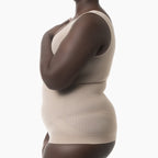 Beige shapewear worn by a model on a white background