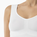 White tank top worn by a mannequin on a white background