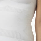 Close-up of a textured white garment on a blurred background