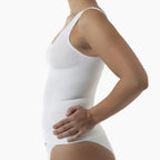 White tank top worn by a person on a white background