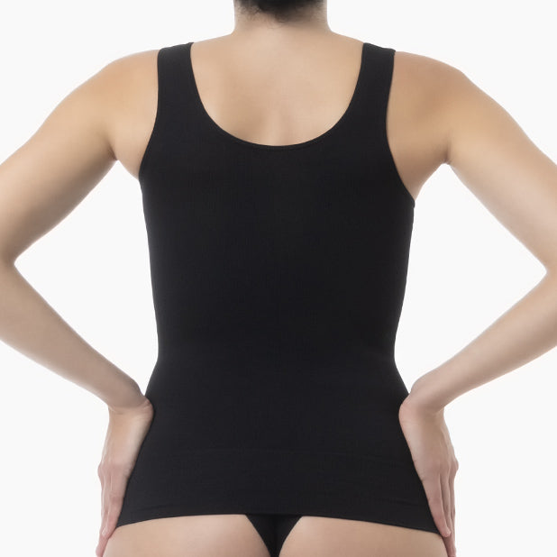 Black tank top worn by a person on a white background