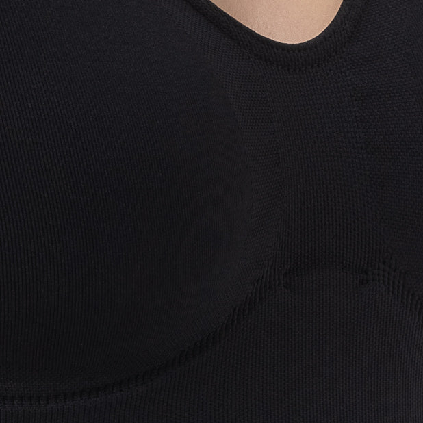 Close-up of a black sleeveless top with a scoop neckline.