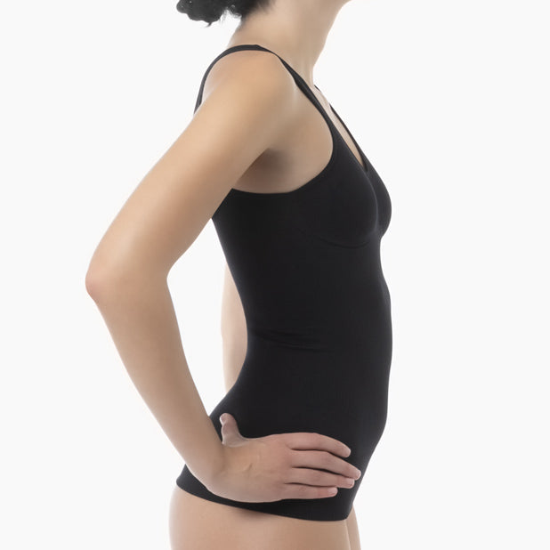 Black tank top worn by a person on a white background