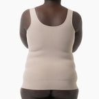 Beige tank top worn by a person on a white background