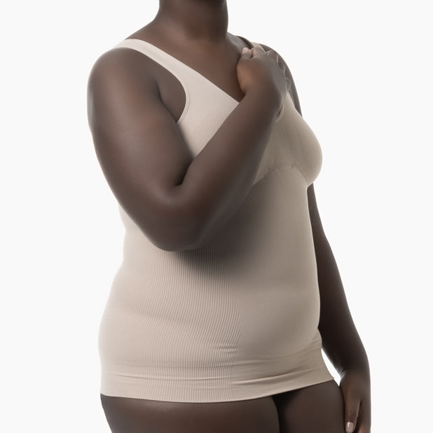 Beige tank top worn by a person on a white background