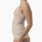 Beige compression garment worn by a person on a white background