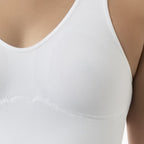 White tank top worn by a person on a neutral background
