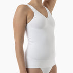 White tank top worn by a person on a white background