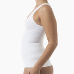 White tank top worn by a person on a white background