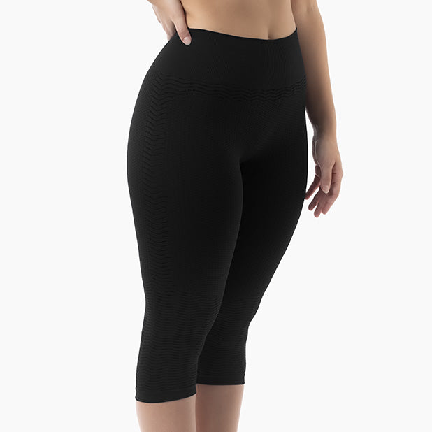 Black leggings worn by a person on a white background