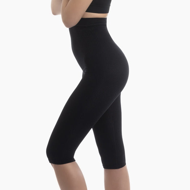 Black high-waisted leggings worn by a mannequin on a white background