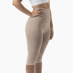 Beige shapewear leggings worn by a person on a white background
