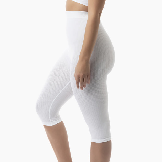 White compression shorts worn by a person on a white background