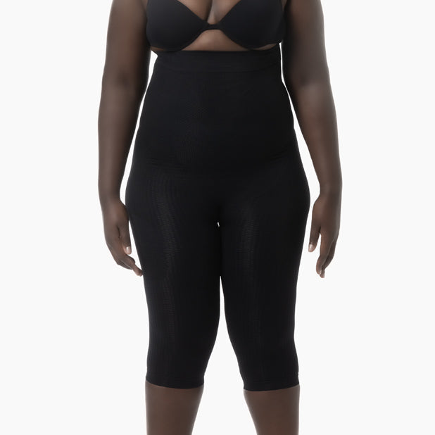 Black shapewear garment on a white background