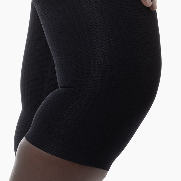 Black knee-high sock on a white background