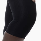 Black knee-high sock on a white background