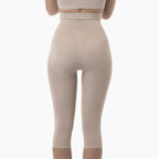 Beige leggings worn by a person on a white background