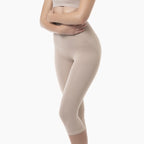Beige leggings worn by a person on a white background