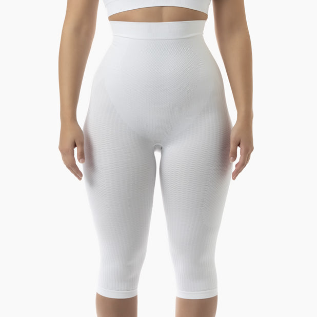 White capri leggings worn by a person on a white background