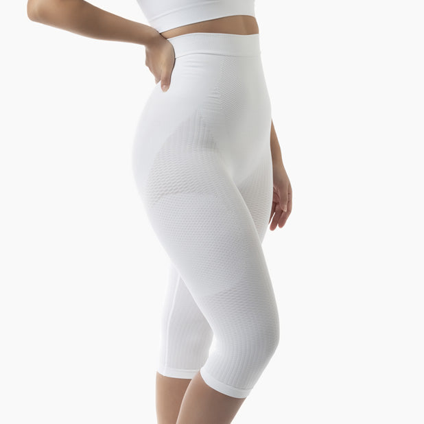 White leggings worn by a person on a white background