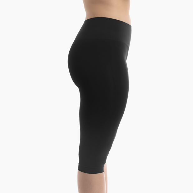 Black leggings worn by a person on a white background