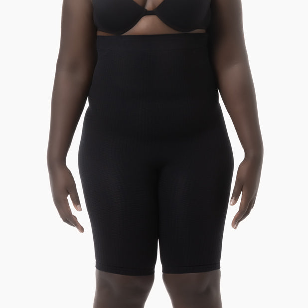 Black shapewear garment on a white background