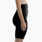 Black shapewear being worn on a white background