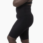 Black shapewear garment on a white background