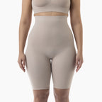 Beige ribbed high-waisted shorts worn by a person on a white background