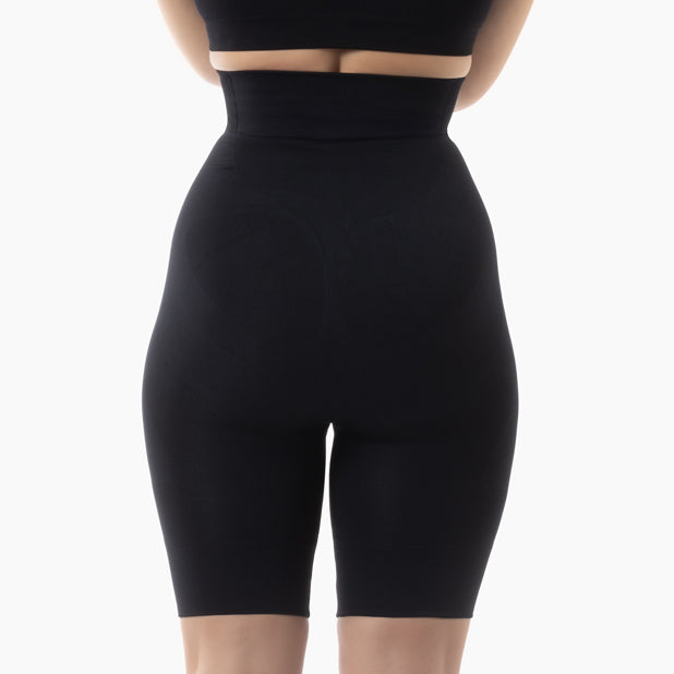 Black high-waisted shapewear shorts on a white background