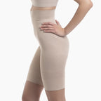 Beige shapewear shorts worn by a person on a white background