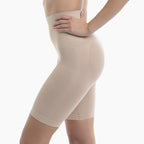 Beige shapewear shorts worn by a person on a white background