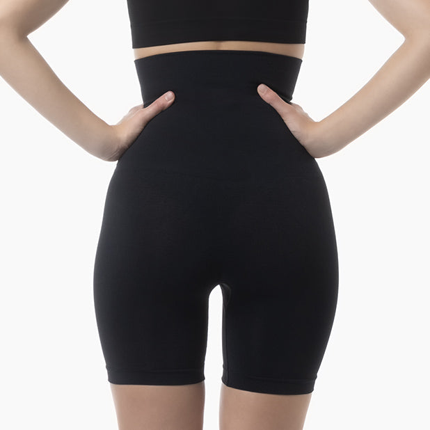 Black high-waisted shapewear shorts on a white background