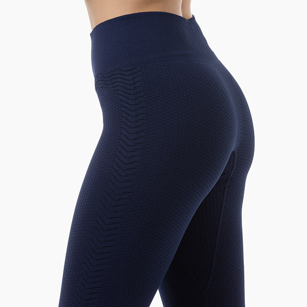 Navy blue leggings with a textured pattern on a white background