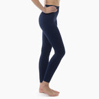 Navy blue leggings worn by a person on a white background