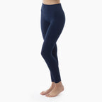 Navy blue leggings worn by a person on a white background