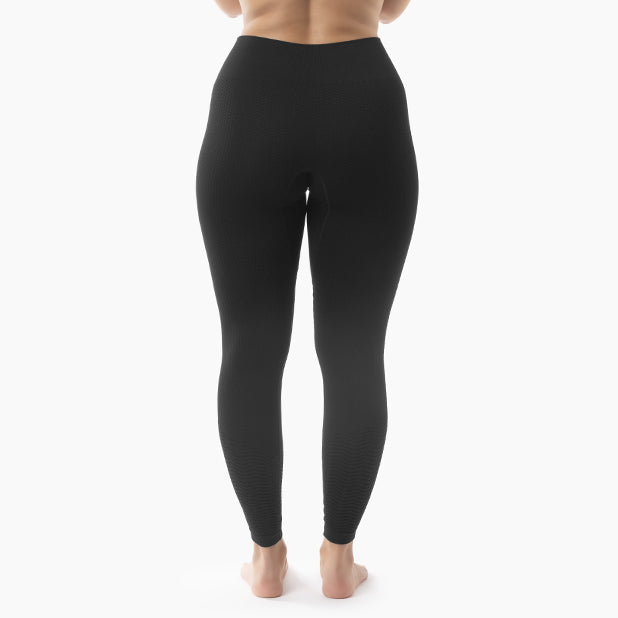 Black leggings worn by a person on a white background