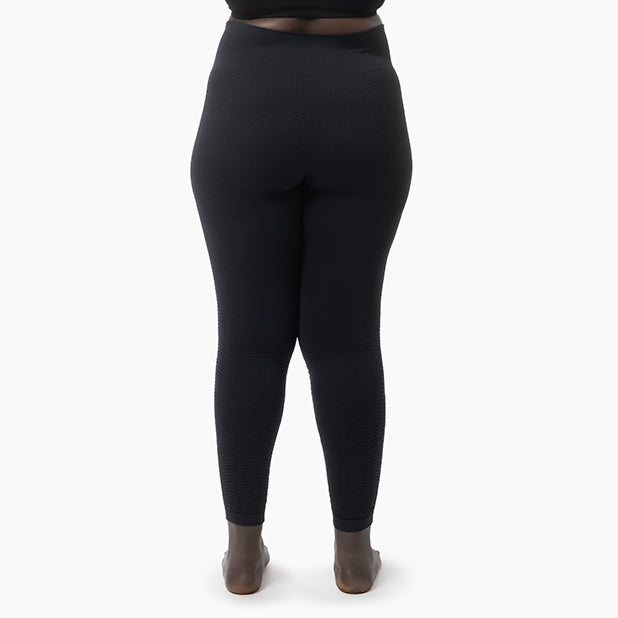 Black leggings worn by a person on a white background