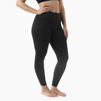 Person wearing black leggings on a white background