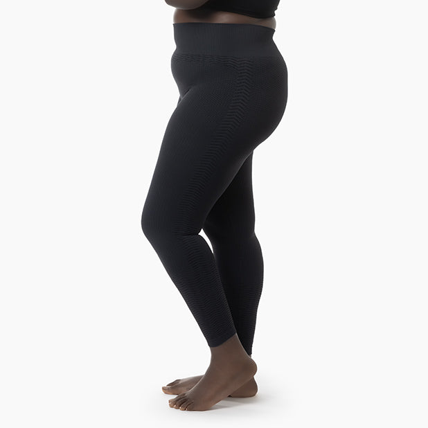 Black leggings worn by a person on a white background