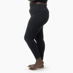 Black leggings worn by a person on a white background