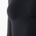 Close-up of a textured black garment on a white background