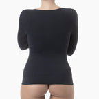 Black long-sleeve top worn by a person on a white background