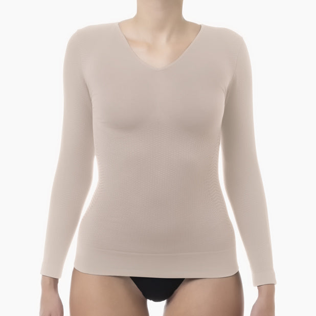 Beige long-sleeve shirt worn by a mannequin on a white background