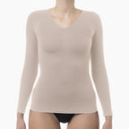 Beige long-sleeve shirt worn by a mannequin on a white background