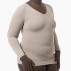 Beige long-sleeve top worn by a model on a white background