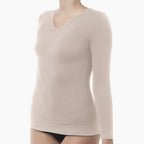 Beige long-sleeve top on a mannequin against a white background