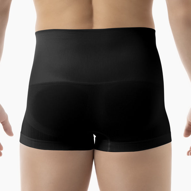 Black boxer briefs worn by a person on a white background