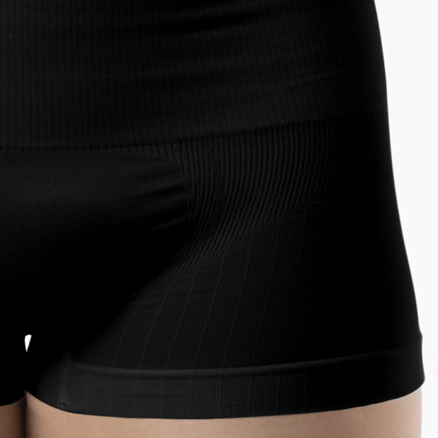 Close-up of black shorts on a neutral background