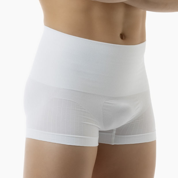 White boxer briefs worn by a person on a white background